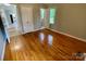 Comfortable bedroom featuring wood floors, a closet, and natural light at 601 Scottsbrook Dr, Charlotte, NC 28213