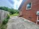 Side of a brick home with a well-maintained lawn, providing a welcoming outdoor atmosphere at 601 Scottsbrook Dr, Charlotte, NC 28213
