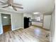 Spacious kitchen featuring white cabinets, black appliances, and modern vinyl floors at 601 Scottsbrook Dr, Charlotte, NC 28213