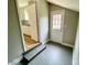 View of a mud room leading into a kitchen with neutral colors and updated flooring at 601 Scottsbrook Dr, Charlotte, NC 28213