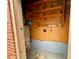 Basement with shelves for storage, with a water heater and pegboard for tools at 601 Scottsbrook Dr, Charlotte, NC 28213