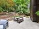 Back patio with a dining table and comfortable benches, ideal for outdoor dining in a peaceful and private setting at 6017 Lake Providence Ln, Charlotte, NC 28277