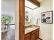 Bright bathroom with granite countertop, skylight, and contemporary fixtures at 6017 Lake Providence Ln, Charlotte, NC 28277