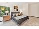 Comfortable bedroom features soft lighting and warm tones, creating a relaxing atmosphere at 6017 Lake Providence Ln, Charlotte, NC 28277