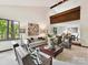 Open-concept living room with vaulted ceilings and a large window offering scenic views at 6017 Lake Providence Ln, Charlotte, NC 28277