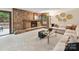 Cozy living room showcasing a stone fireplace and natural lighting at 6017 Lake Providence Ln, Charlotte, NC 28277