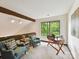 Cozy office space with green accents, desk, and a large window overlooking nature at 6017 Lake Providence Ln, Charlotte, NC 28277
