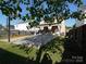 Large backyard with basketball court and patio, perfect for outdoor activities and relaxation at 6114 Paw Village Rd, Charlotte, NC 28214