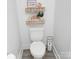 Toilet with decorative shelves, creating a stylish and functional bathroom space at 6114 Paw Village Rd, Charlotte, NC 28214