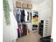 Organized walk-in closet featuring ample hanging space, shelving, and basket storage for maximum efficiency at 6114 Paw Village Rd, Charlotte, NC 28214
