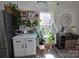 Bright kitchen featuring white countertops, cabinets and stainless steel appliances with plants and decor at 6114 Paw Village Rd, Charlotte, NC 28214