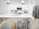 Modern kitchen with a large island and stylish lighting fixtures at 6114 Paw Village Rd, Charlotte, NC 28214