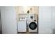 Efficient laundry room featuring a modern washer and dryer set, with shelving for storage at 6114 Paw Village Rd, Charlotte, NC 28214
