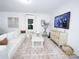 Bright living room features a plush white sofa, stylish rug, and contemporary decor at 6114 Paw Village Rd, Charlotte, NC 28214