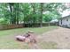 Fenced-in backyard with mature shade trees and patio at 6409 Pineburr Ct, Charlotte, NC 28211