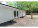Back of house featuring back door and sliding glass doors at 6409 Pineburr Ct, Charlotte, NC 28211