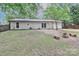 View of the spacious backyard with a fire pit, perfect for outdoor gatherings and relaxation at 6409 Pineburr Ct, Charlotte, NC 28211