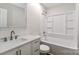 A bathroom offering a shower and tub combination, vanity and lavatory at 6409 Pineburr Ct, Charlotte, NC 28211