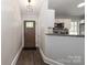 Inviting entryway features hardwood floors, modern lighting and flows into a charming kitchen with stainless steel appliances at 6409 Pineburr Ct, Charlotte, NC 28211