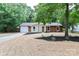 Charming single-Gathering home with an attached garage and well-manicured front yard at 6409 Pineburr Ct, Charlotte, NC 28211