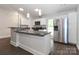 Kitchen featuring stainless steel appliances, granite countertops and modern lighting at 6409 Pineburr Ct, Charlotte, NC 28211