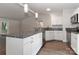 Kitchen boasts granite countertops, a breakfast bar and stainless steel appliances creating a modern cooking space at 6409 Pineburr Ct, Charlotte, NC 28211