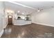 Open floor plan features a modern kitchen with stainless steel appliances and easy access to the front door at 6409 Pineburr Ct, Charlotte, NC 28211