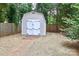 Backyard shed with double doors, providing extra storage space and organization at 6409 Pineburr Ct, Charlotte, NC 28211