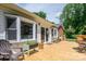 Wooden back porch with seating and view of the home's interior through sliding glass doors at 712 2Nd Nw Ave, Conover, NC 28613