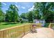 Wooden deck with a view of the expansive backyard, mature trees and shed at 712 2Nd Nw Ave, Conover, NC 28613