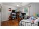 Bedroom with hardwood floors, a daybed, a ceiling fan, and a workspace at 712 2Nd Nw Ave, Conover, NC 28613