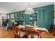Charming dining area with hardwood floors, built-in shelving, and a decorative chandelier at 712 2Nd Nw Ave, Conover, NC 28613