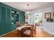 Cozy dining room featuring hardwood floors, a large chandelier, and built-in shelving at 712 2Nd Nw Ave, Conover, NC 28613