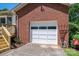 Spacious single-car garage with white door, offering convenient parking and storage at 712 2Nd Nw Ave, Conover, NC 28613