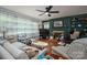Spacious living room featuring large windows, a fireplace, hardwood floors, and comfortable seating at 712 2Nd Nw Ave, Conover, NC 28613
