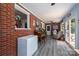 Cozy living room with hardwood floors, exposed brick wall and views of the backyard at 712 2Nd Nw Ave, Conover, NC 28613