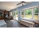Open living room with hardwood floors, a large window and sliding doors leading to the deck at 712 2Nd Nw Ave, Conover, NC 28613