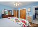 Main bedroom featuring hardwood floors, dresser, ceiling fan, and an ensuite bathroom at 712 2Nd Nw Ave, Conover, NC 28613