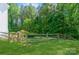 A backyard features a wooden fence, providing privacy and defining the property's boundary, creating a secluded outdoor space at 7128 Rock Bass Ct, Concord, NC 28025