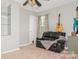 Relaxing bedroom featuring a leather loveseat, carpeted floors, neutral walls and guitars at 7128 Rock Bass Ct, Concord, NC 28025