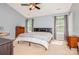 Spacious bedroom featuring natural light, a ceiling fan, and neutral-toned walls at 7128 Rock Bass Ct, Concord, NC 28025