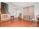 Welcoming entry with wood floors, stairs and a view of the living spaces at 7128 Rock Bass Ct, Concord, NC 28025