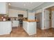 Bright kitchen with stainless steel appliances, butcher block island, and tile flooring at 7128 Rock Bass Ct, Concord, NC 28025