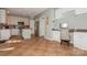 Well-lit kitchen featuring white cabinetry, stainless steel appliances, and a functional built-in desk at 7128 Rock Bass Ct, Concord, NC 28025