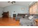 Spacious living room with a fireplace, plush seating, hardwood flooring and a high ceiling at 7128 Rock Bass Ct, Concord, NC 28025