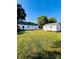 Expansive backyard featuring both the main house and a detached building, perfect for outdoor activities at 716 E Union St, Marshville, NC 28103