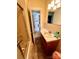 Bathroom featuring a shower-tub combo and vanity sink at 716 E Union St, Marshville, NC 28103