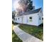 The home features a classic design with a well-manicured lawn and a paved walkway at 716 E Union St, Marshville, NC 28103