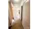 The hallway features built-in shelving, fresh paint, and tiled flooring at 716 E Union St, Marshville, NC 28103