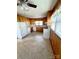 Kitchen with wood cabinets, white appliances, and laminate flooring at 716 E Union St, Marshville, NC 28103